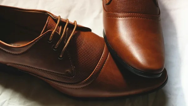 Rich brown leather lace-up shoes with fine detailing